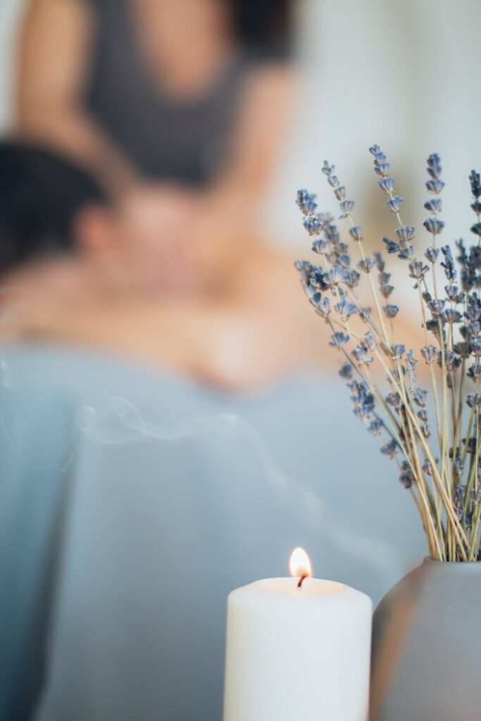 A soothing massage setting with lavender and candlelight for relaxation and aromatherapy.